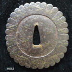 H563. Papered Iron Tsuba, Waves and Chrysanthemum
