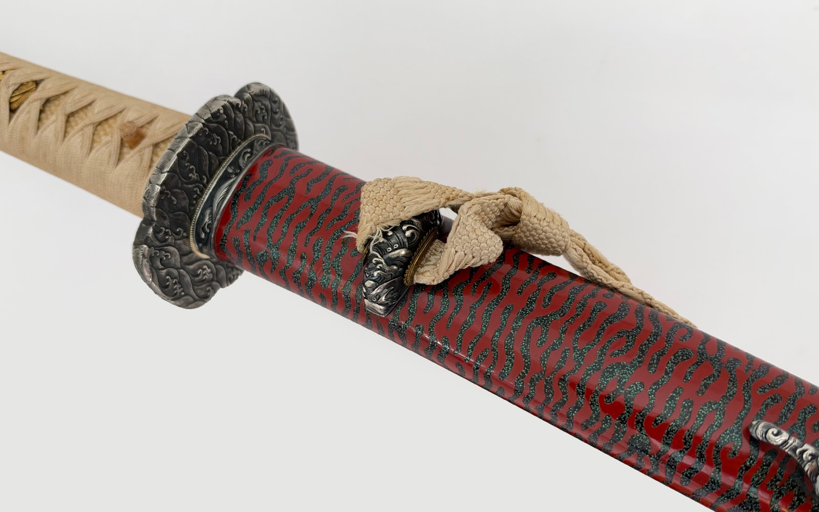 A flamboyant wave theme katana made by Minamoto Ujitoshi