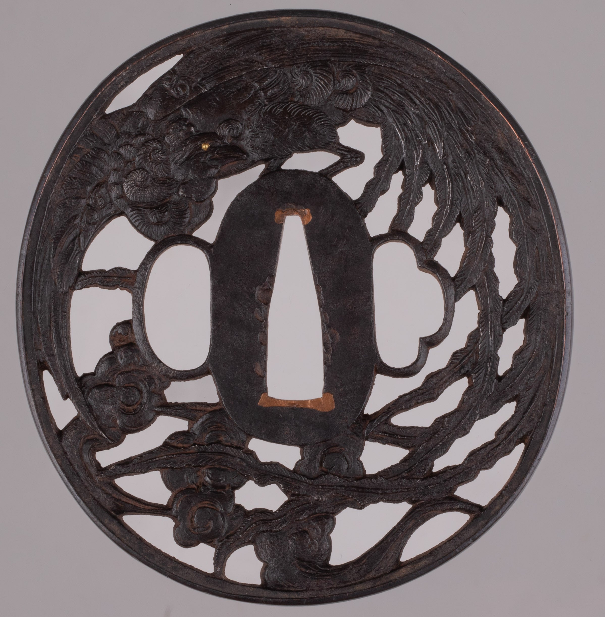 Iron sukashi tsuba decorated with phoenix
