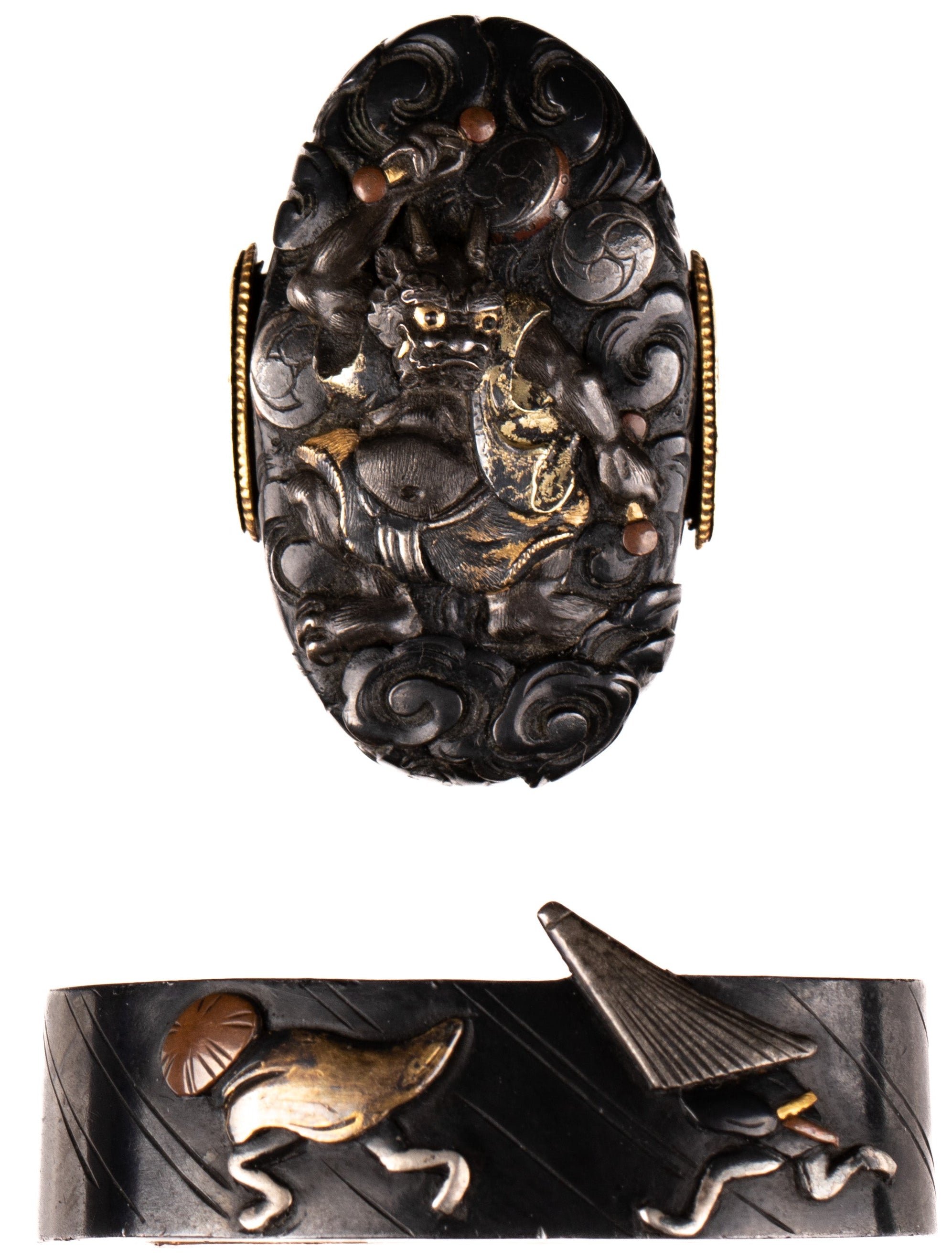 Polished shakudo fuchikashira decorated with Raijin, thunder god