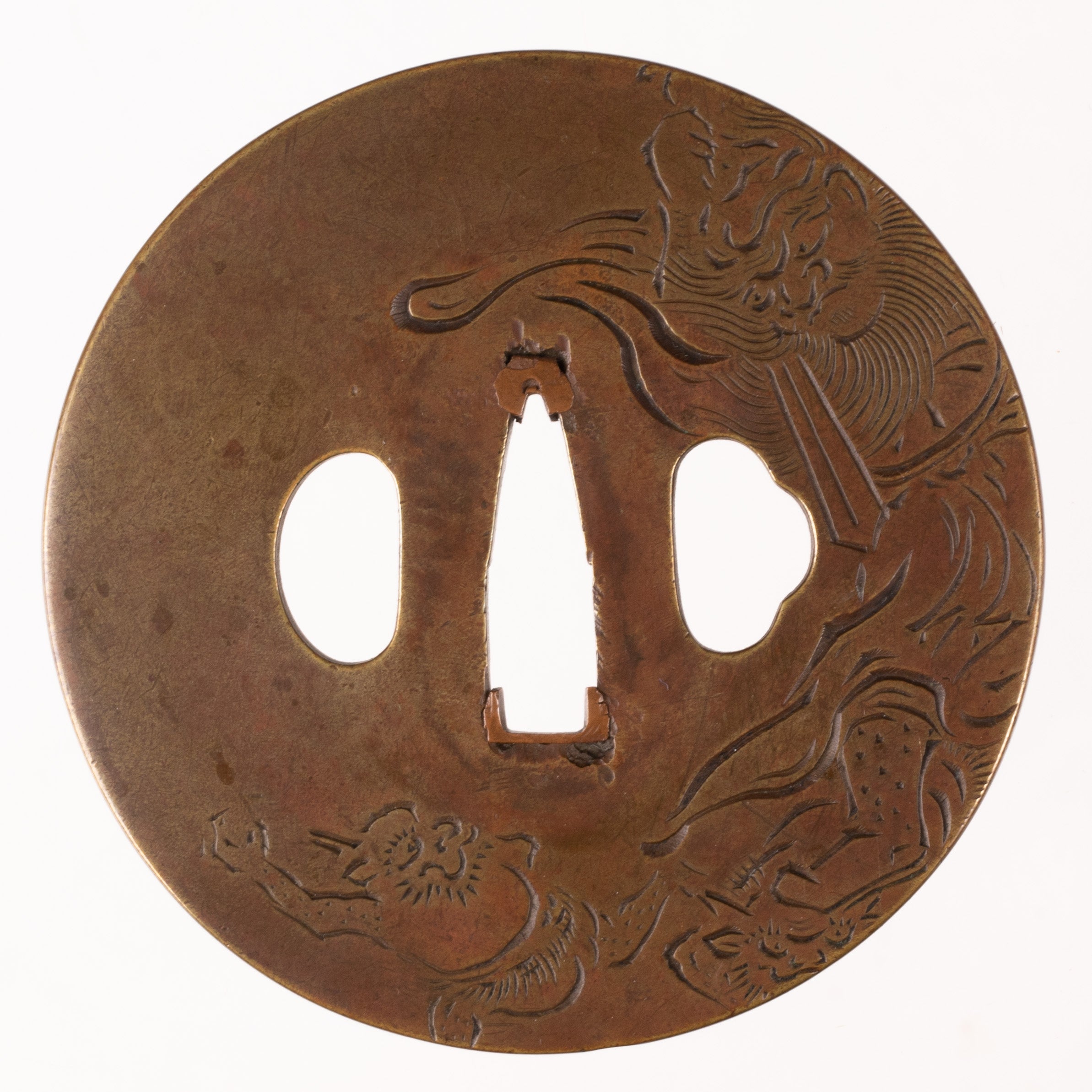 Brass Mito School tsuba with NBTHK Hozon Tosogu. Decorated with Shoki and Oni.